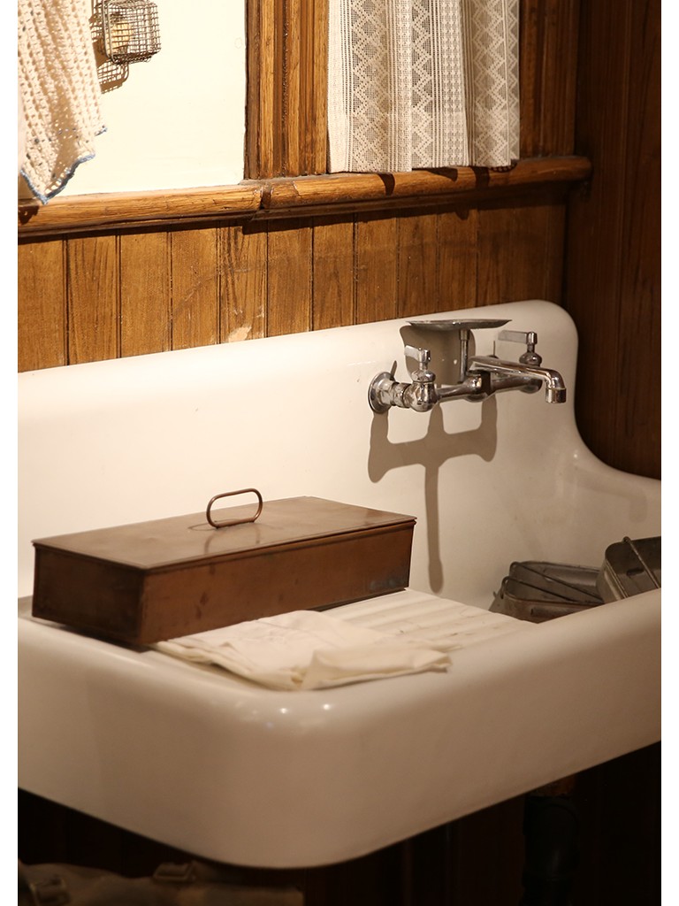 White procelain sink with tool box