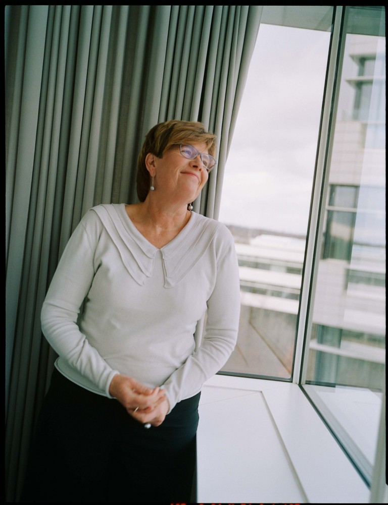 Anne Margrethe is looking out the window from the office
