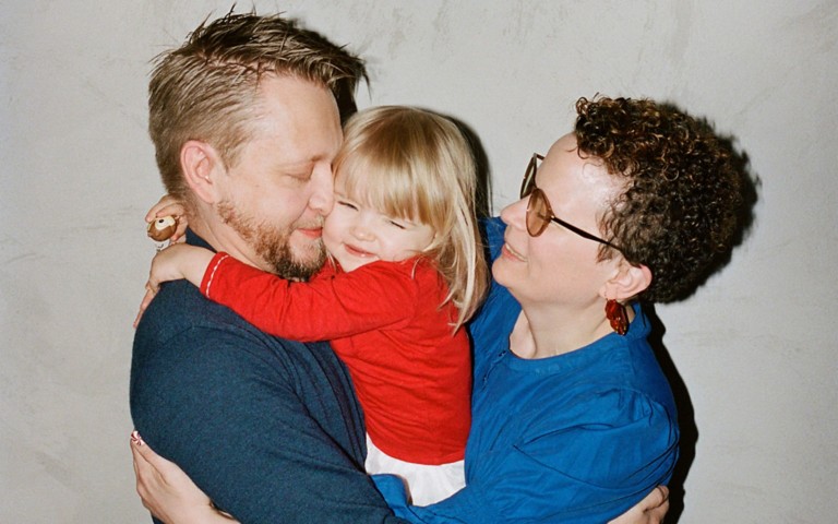 Ronja hugging her family