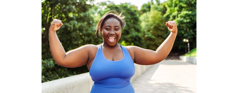 A woman showing her biceps after a successful workout