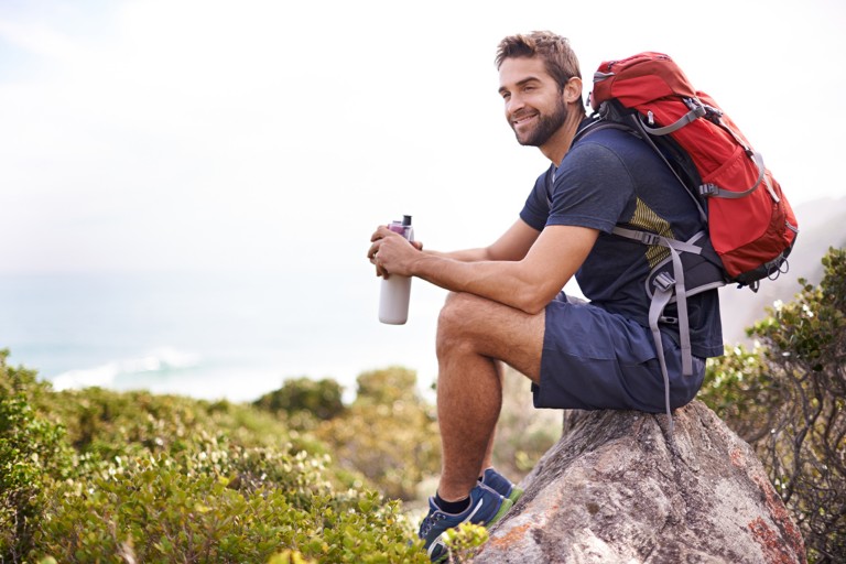 A man taking a break while on a hike