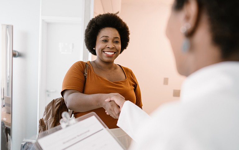 A clinical study patient greeting a health care professional