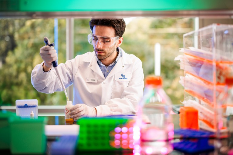A Novo Nordisk employee working in a lab setting