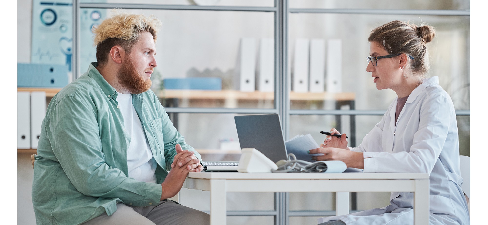 A concerned male patient discussing his health with his doctor