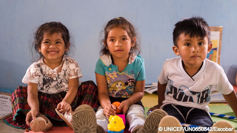 Photo of young children smiling