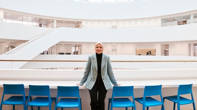 Novo Nordisk employee standing in front of a table