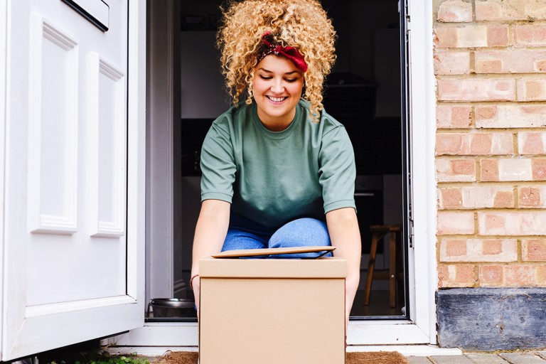 Woman receiving package from NovoCare Pharmacy