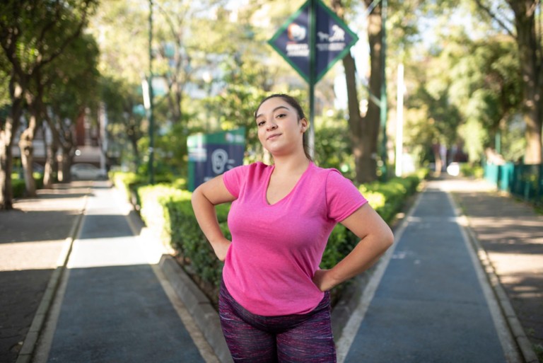 Karla Marino in a green area of town