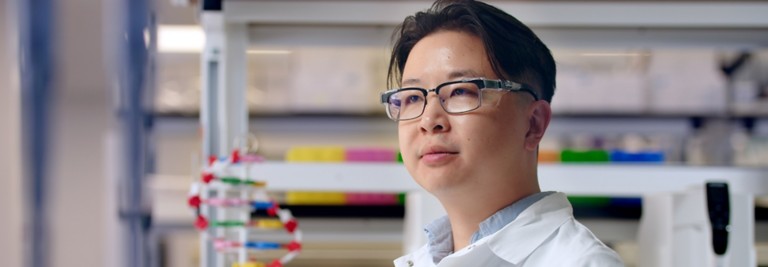 Scientist in the lab wearing a white coat