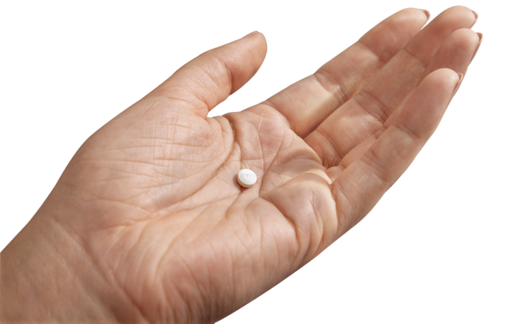 Image of hand holding Wegovy® Pill