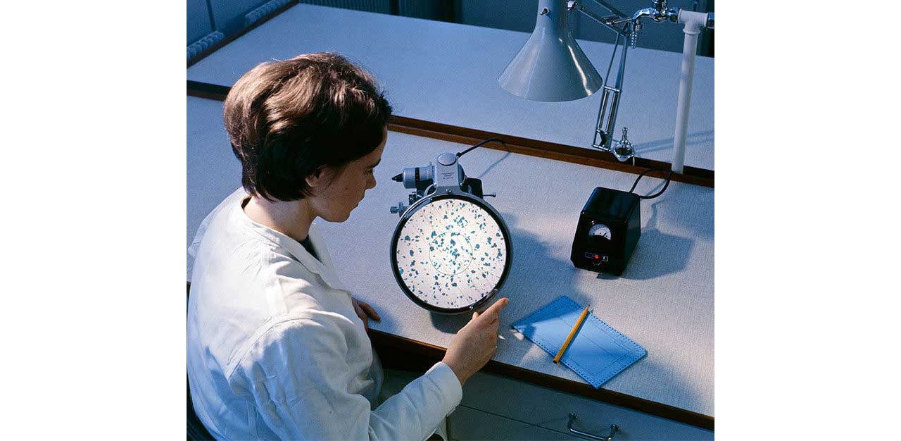 A researcher conducting an experiment in a lab.