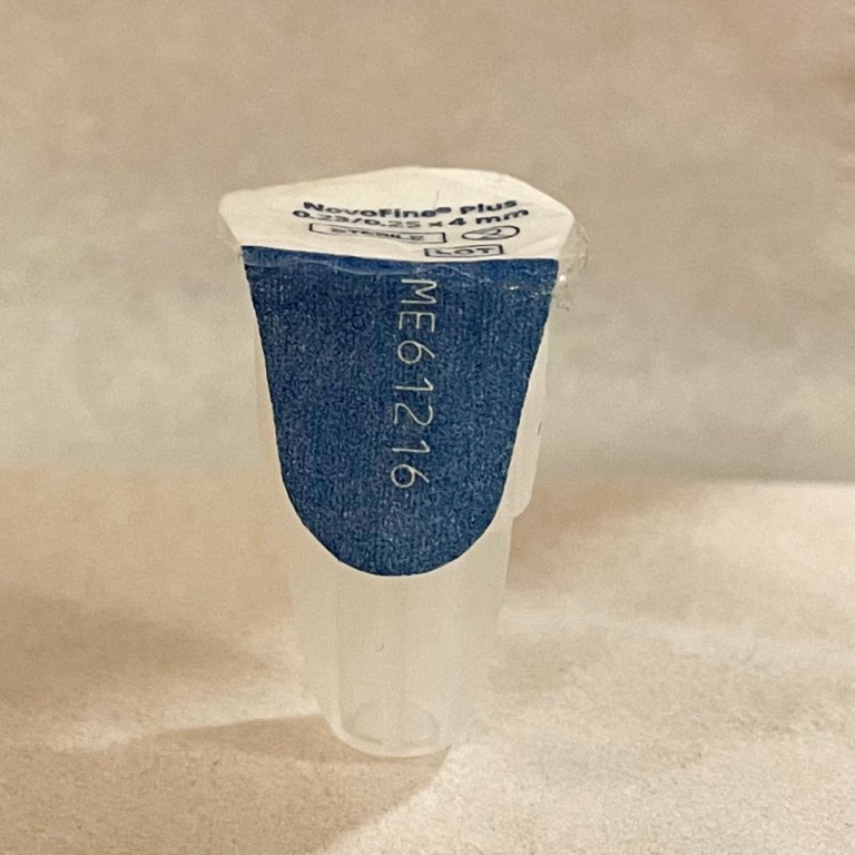  Image showing a side view of an authentic Ozempic® Needle, including the needle lot number.]