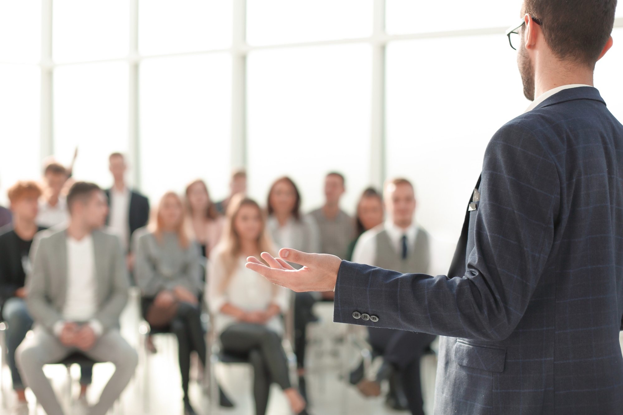 close up. speaker standing in front of the audience in the conference room. photo with copy space
