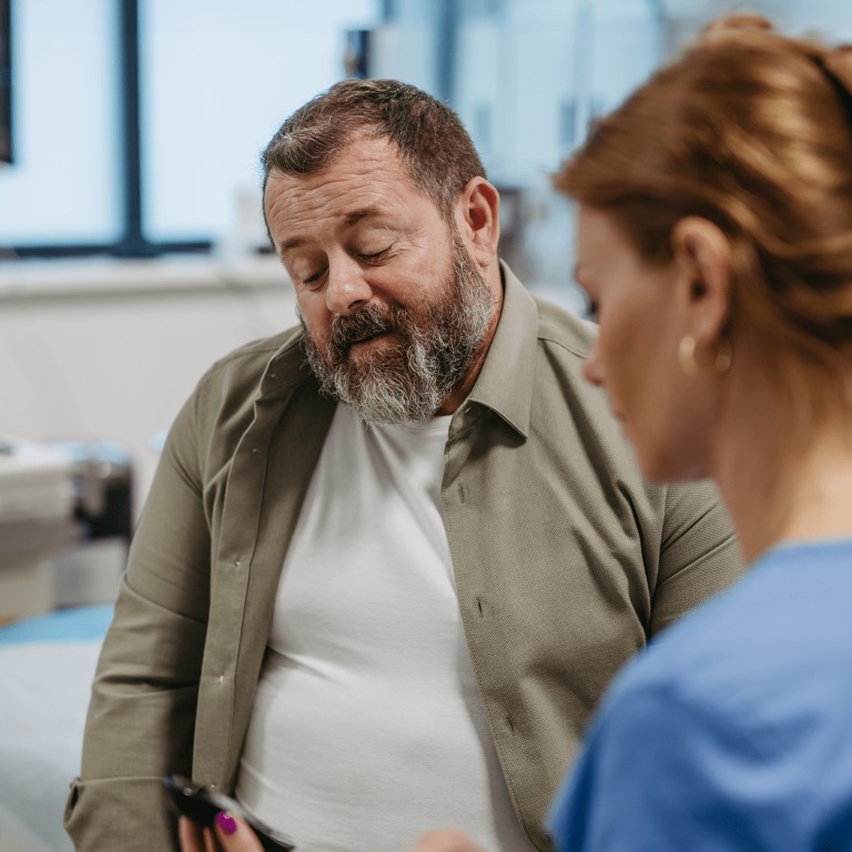 Image of a man speaking with a healthcare professional